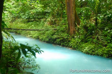 Laguna Azul offers stunning blue waters and lush rainforest surroundings